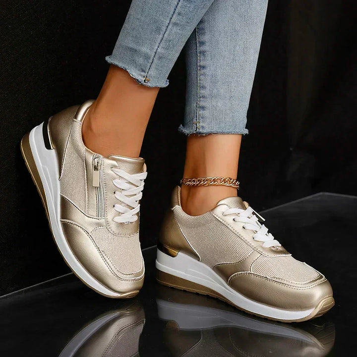 Elegant gold metallic women's platform trainers, orthopaedic for all-day comfort, lace-up fashion sneakers.