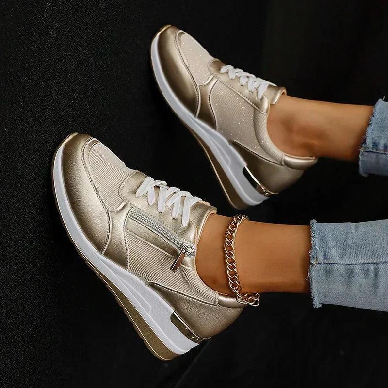 Stylish silver metallic women's orthopaedic platform trainers, comfortable casual shoes with functional zip detail.
