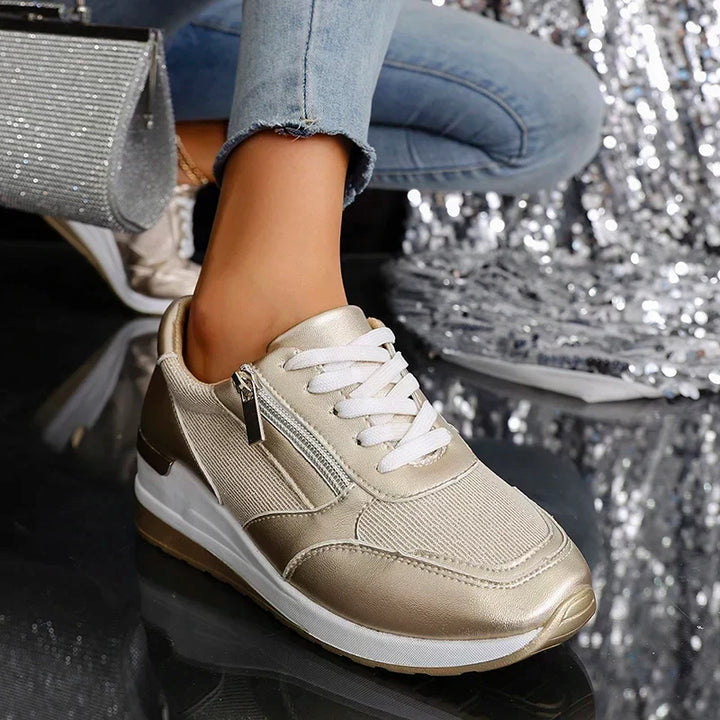 Casual women's fashion sneakers, orthopaedic platform trainers, in striking gold and silver metallic.