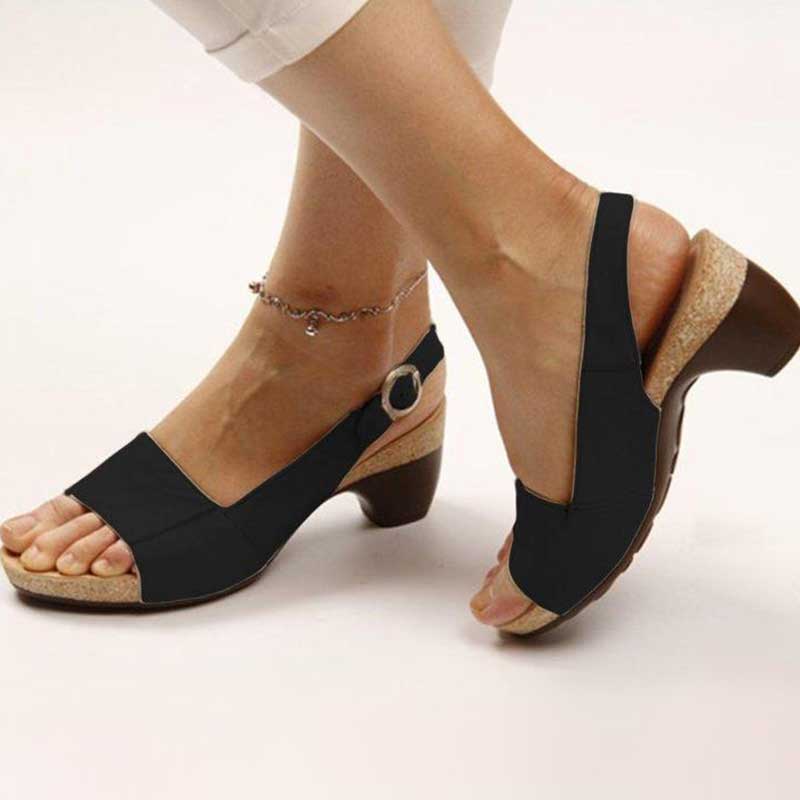 Close-up of the supportive footbed on women's comfortable wedge sandals, highlighting orthopedic design.