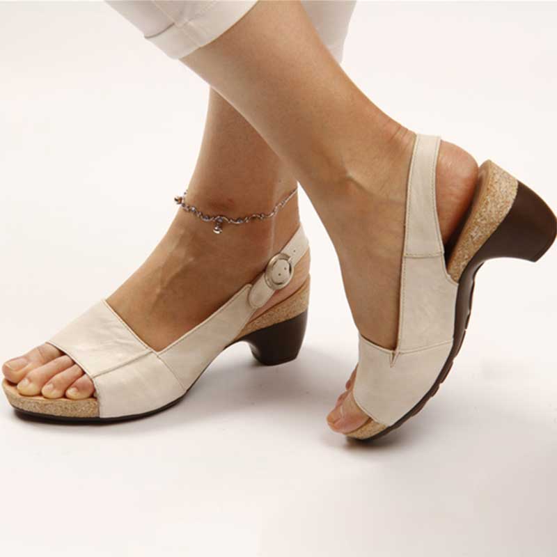 Stylish summer fashion sandals for women, featuring a comfortable low wedge heel and elegant straps.