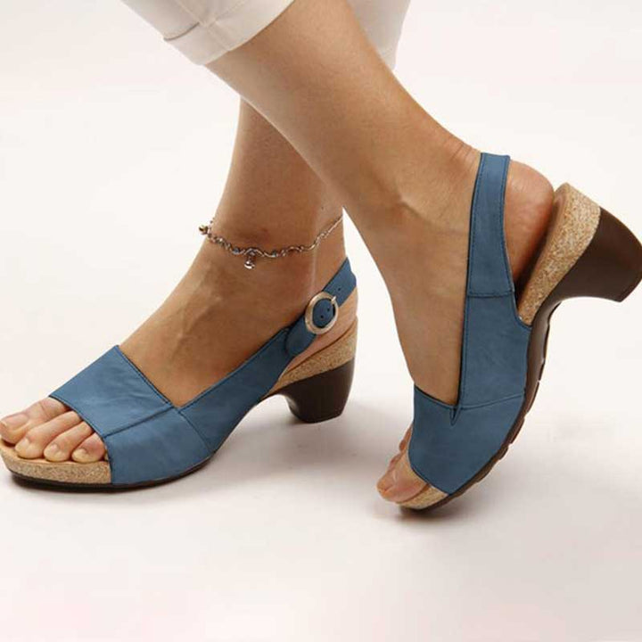 Model wearing women's stylish and comfortable wedge sandals, perfect for summer outings and daily activities.