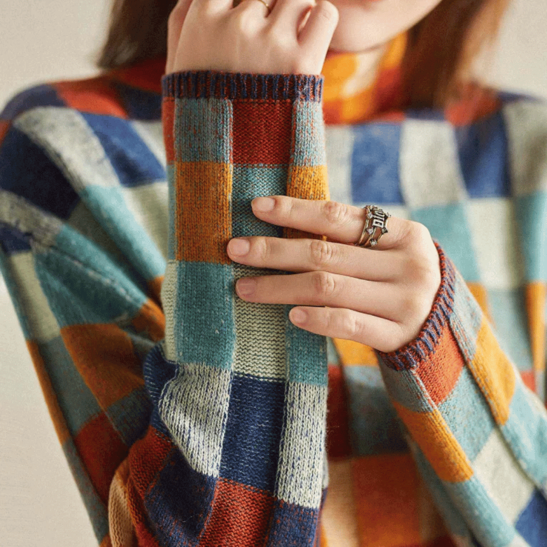 Cozy orange patchwork turtleneck sweater for women, perfect for stylish autumn outfits & winter fashion.