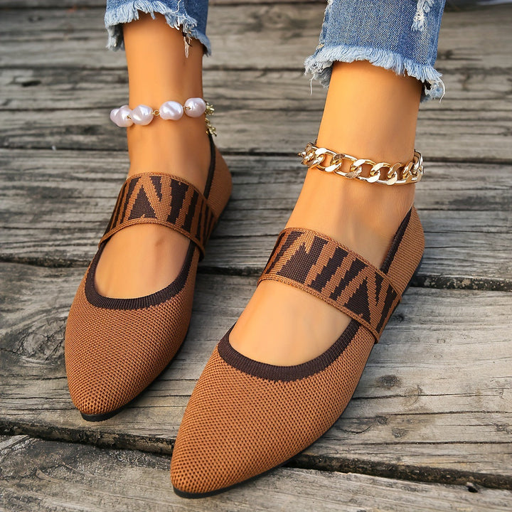 Versatile women's patterned ballet flats. Comfortable slip-on, pointed toe shoes for modern chic everyday style.