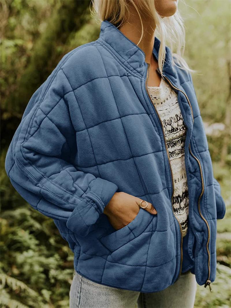 Lightweight quilted women's jacket, a versatile zippered outerwear piece for spring fashion.