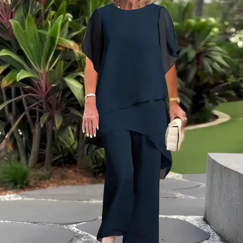 Women's chic relaxed ensemble. Elegant two-piece set with a layered top & wide-leg pants for effortless style.