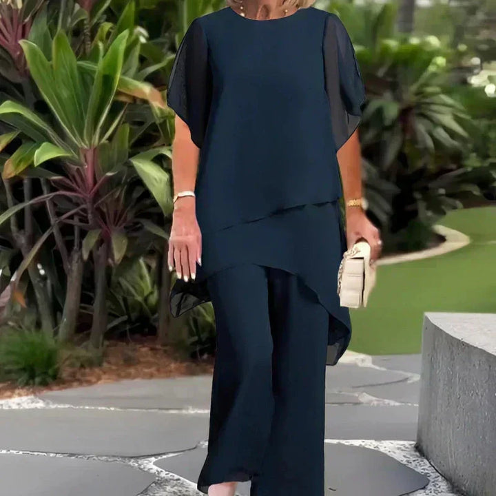 Women's chic relaxed ensemble. Elegant two-piece set with a layered top & wide-leg pants for effortless style.