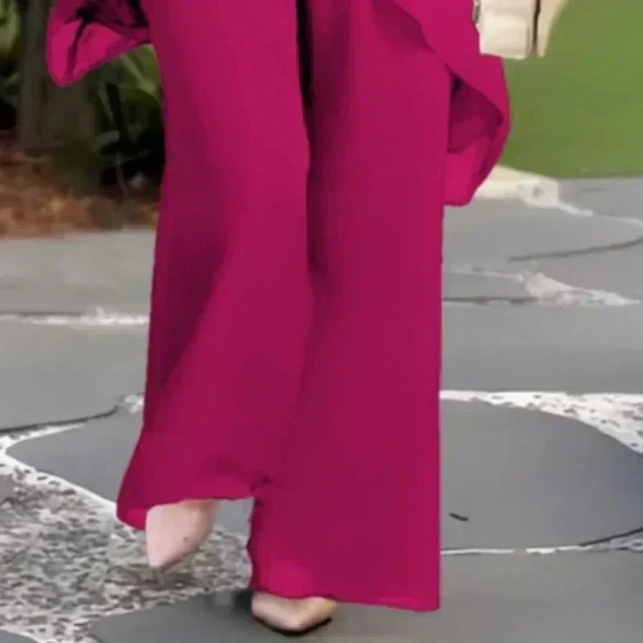 Soft women's two-piece ensemble. Chic layered top & breathable wide-leg pants for ultimate comfort & style.