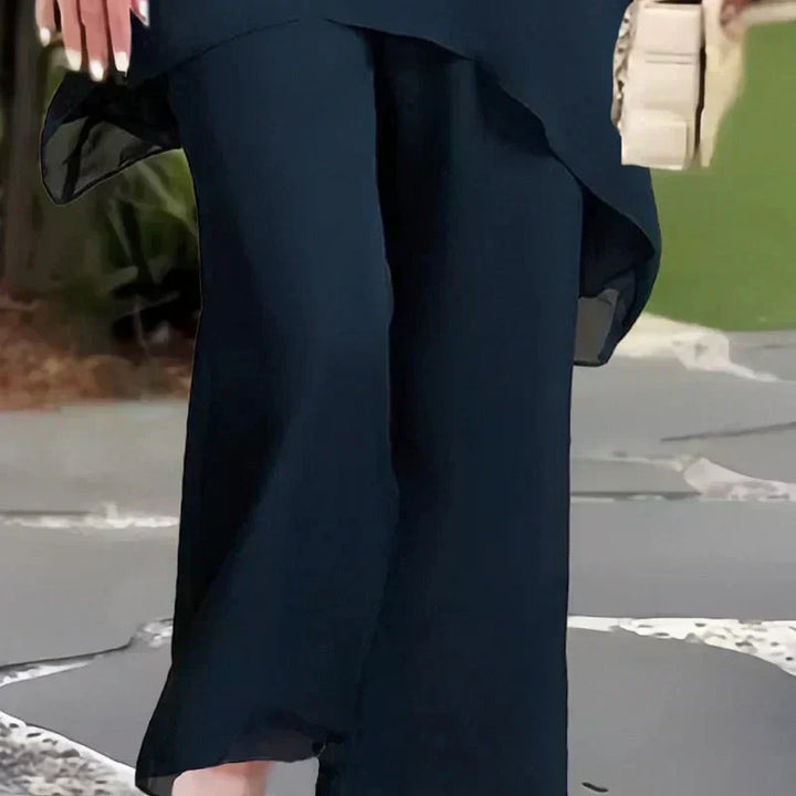 Versatile women's spring ensemble. Relaxed two-piece set with wide-leg pants & elegant layered top. Casual/dressy.