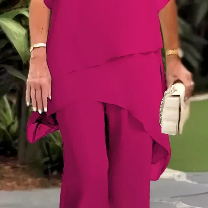 Fashionable women's two-piece set. Modern layered top and wide-leg pants create a chic, effortless look.