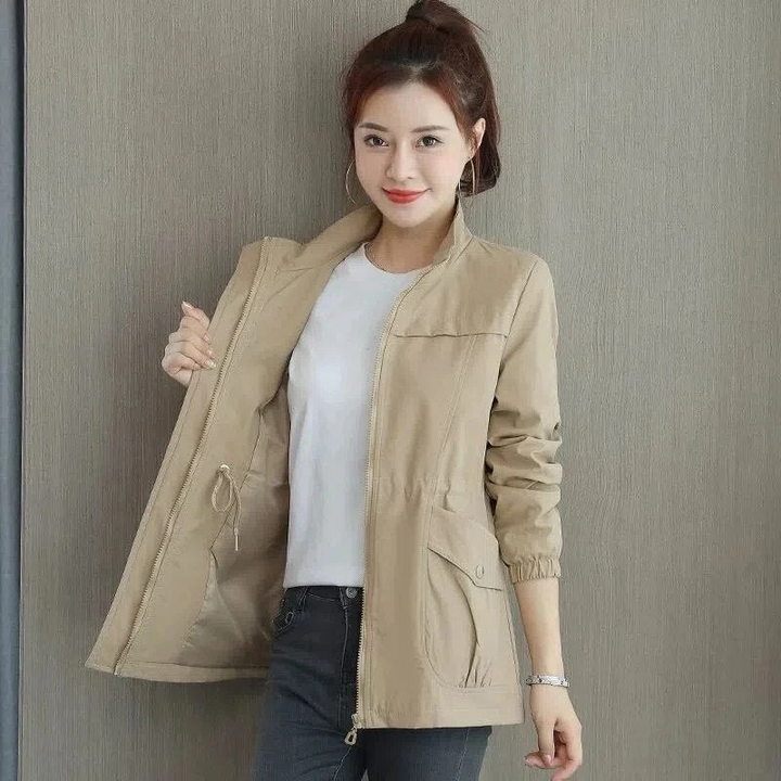 Women's chic short summer jacket in lightweight fabric, perfect transitional outerwear.