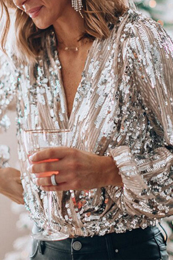 Shimmering women's silver blouse, elegant long-sleeve top perfect for evening events & versatile daytime chic.