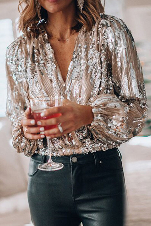Elegant women's silver long-sleeve blouse with a subtle shimmer, ideal for both formal parties and casual fashion.