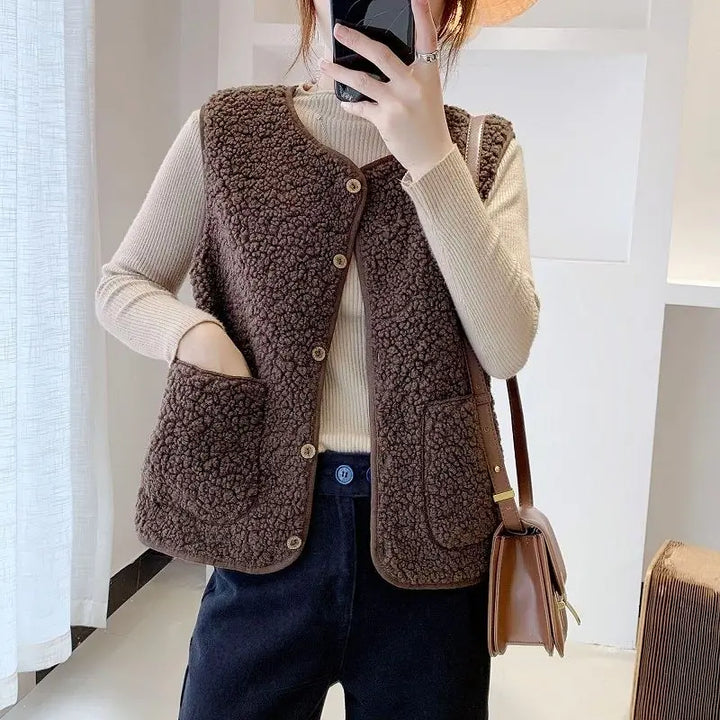 Stylish women's V-neck layering vest. Sleeveless button-front cardigan, ideal for casual fall fashion.