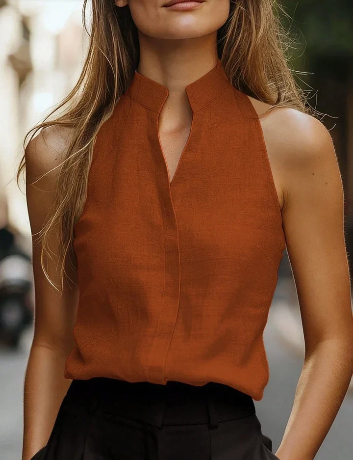 Elegant women's sleeveless V-notch blouse with a modern cut, a comfortable and versatile top for any occasion.
