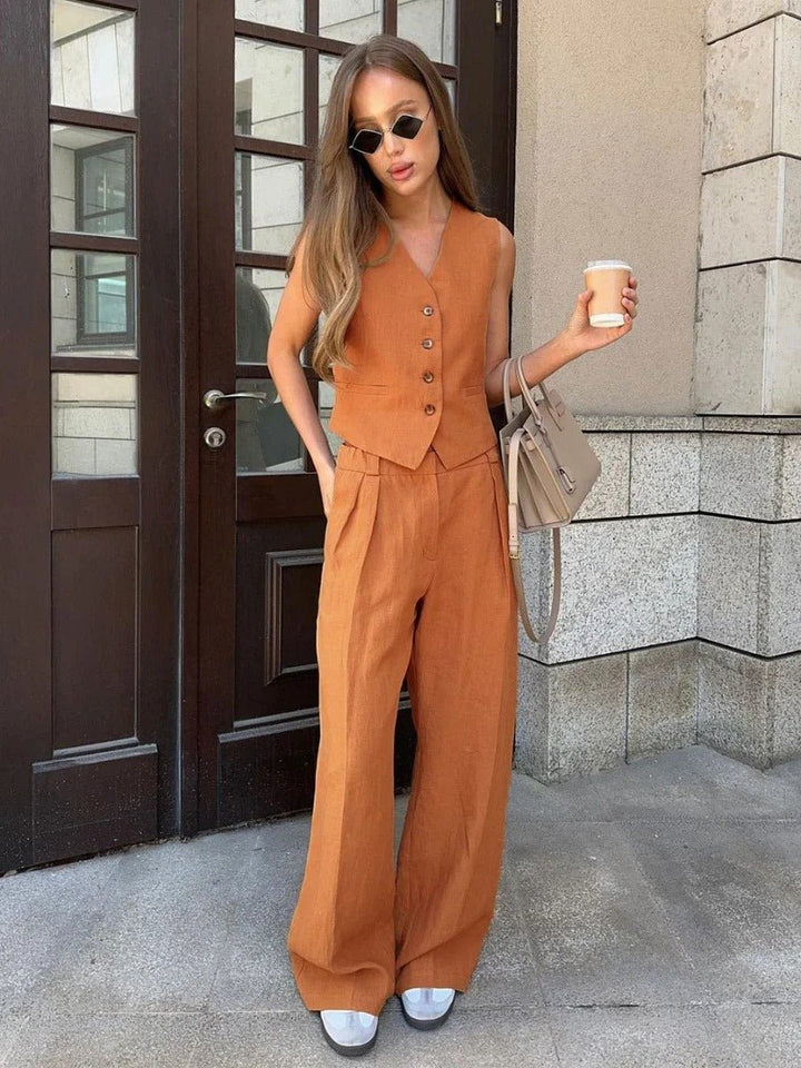 Woman wearing an elegant sleeveless vest and comfortable wide-leg trousers set, ideal for sophisticated daily wear.