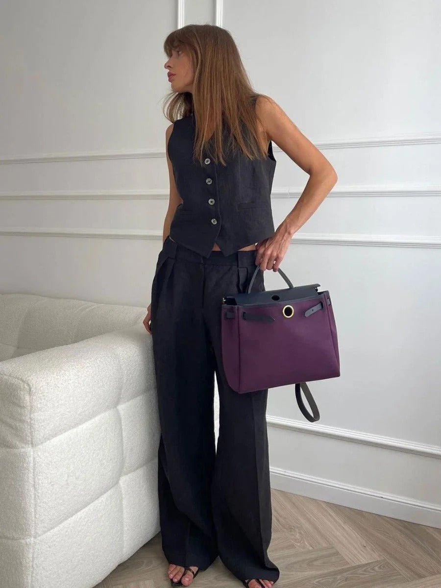 Fashionable women's two-piece set featuring a chic sleeveless vest and trendy wide-leg trousers for a sleek ensemble.