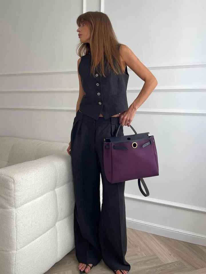 Fashionable women's two-piece set featuring a chic sleeveless vest and trendy wide-leg trousers for a sleek ensemble.