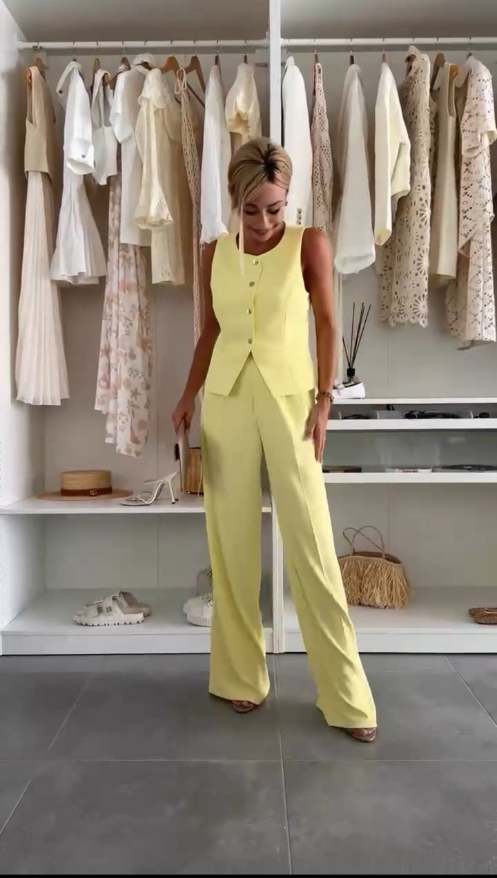 Women's chic sleeveless vest & straight-leg trousers set, a versatile two-piece co-ord for elegant wear.