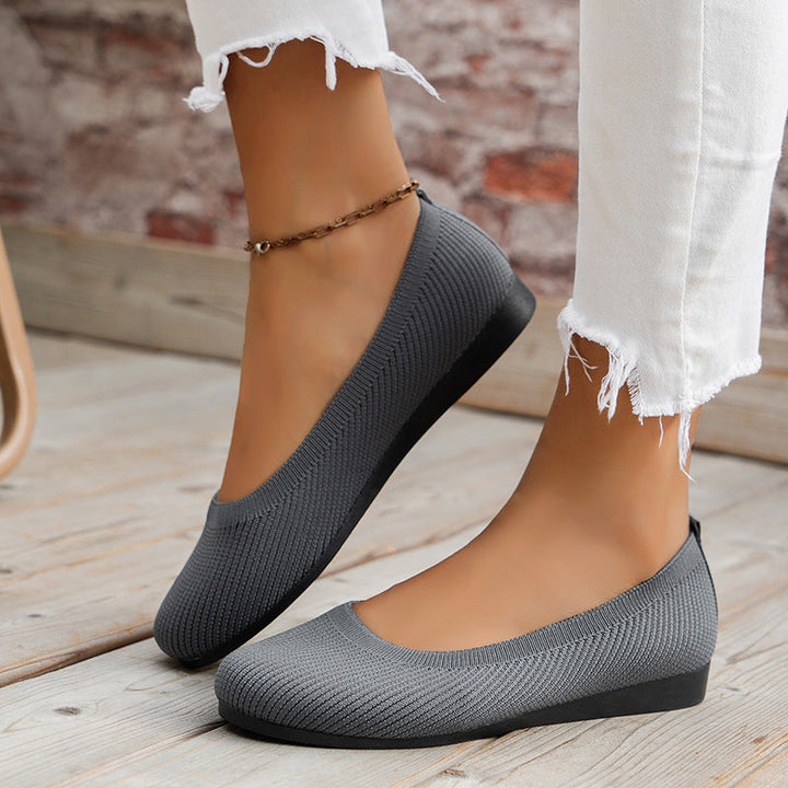 A pair of women's lightweight athletic sneakers designed for maximum comfort