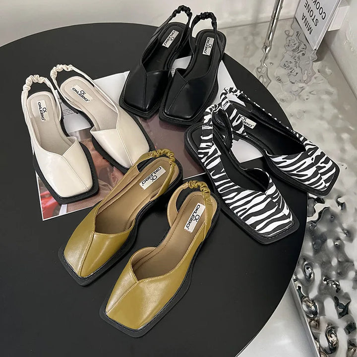 Stylish women's slingback sandals featuring a unique square toe, perfect for any outfit