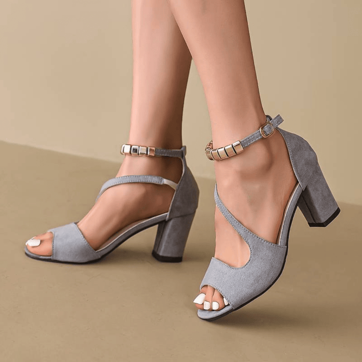 Chic women's strappy high heels with an open-toe design, essential elegant shoes for a stylish look.