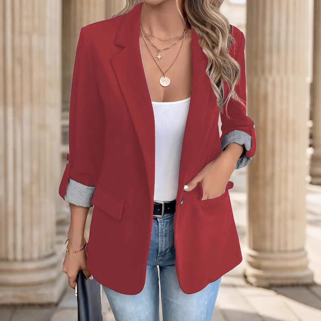 Modern women's striped blazer jacket, ideal for a sophisticated office look or professional events.