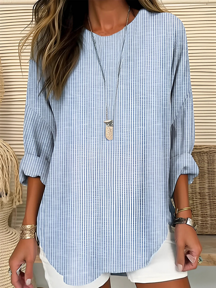 Women's chic striped blouse with long sleeves & crew neck. Versatile, casual & elegant top for work or everyday style.