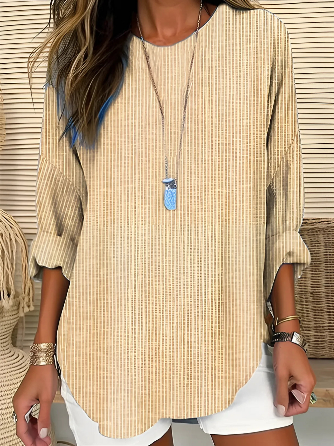 Trendy women's striped long-sleeve blouse. Effortless casual-elegant top, perfect for workwear or relaxed fashion.