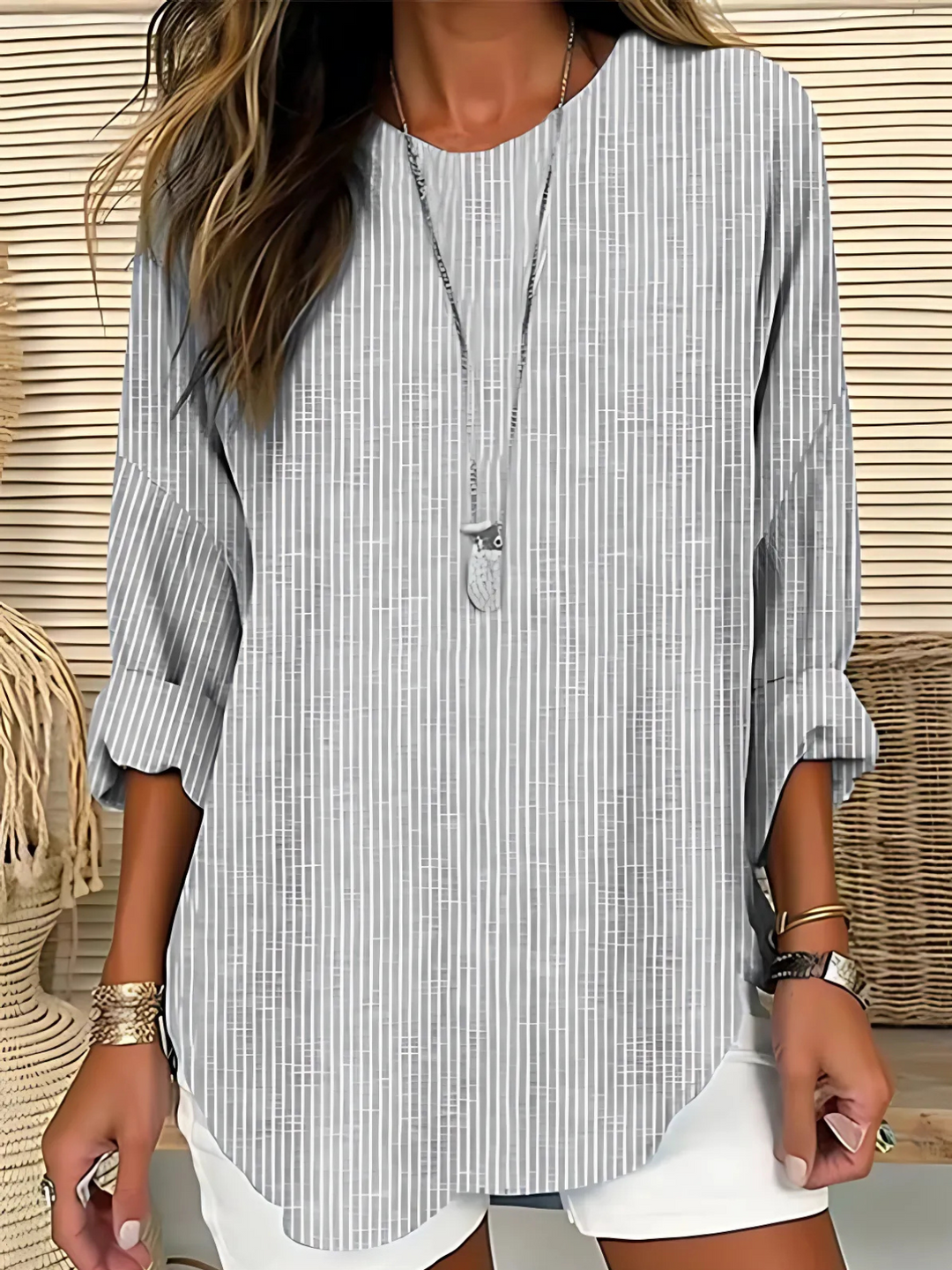 Relaxed fit women's striped crew neck blouse. Long sleeve top, versatile for trendy casual wear or chic work style.