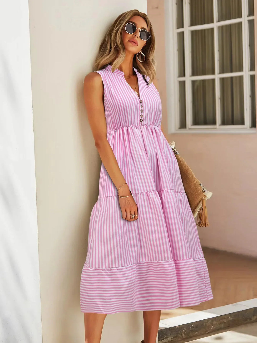 Comfortable women's striped midi dress, sleeveless design for chic summer fashion and vacation wear.