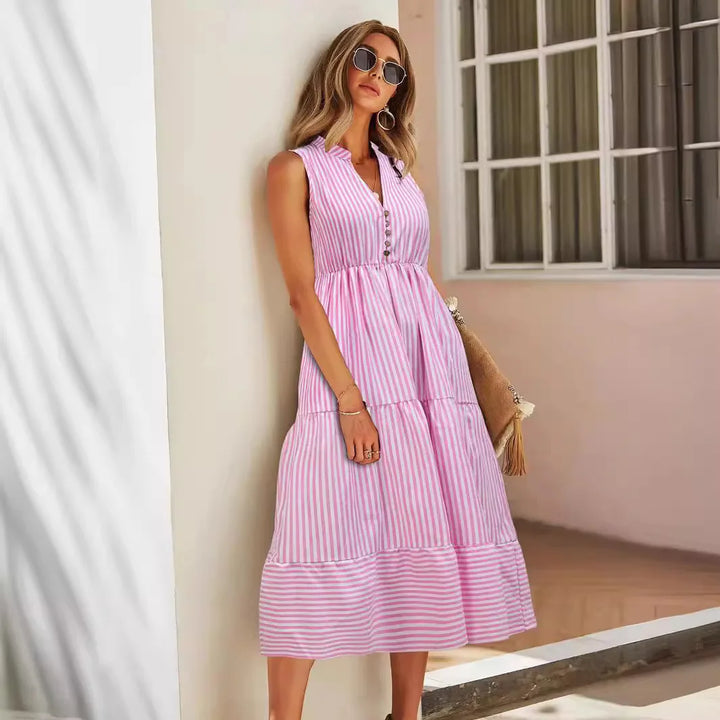 Chic striped women's midi dress, sleeveless and perfect for warm weather, featuring a relaxed tiered skirt.