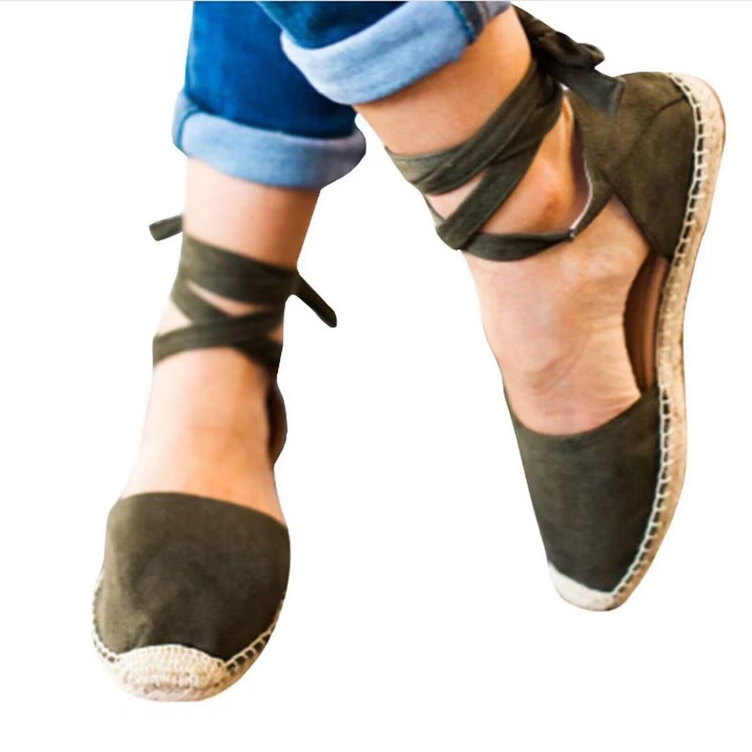 Stylish women's espadrille shoes featuring elegant tie straps, versatile for summer fashion.
