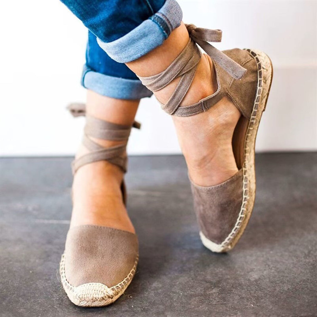 Close-up of a women's tie-strap espadrille showing casual design and summer-ready details.