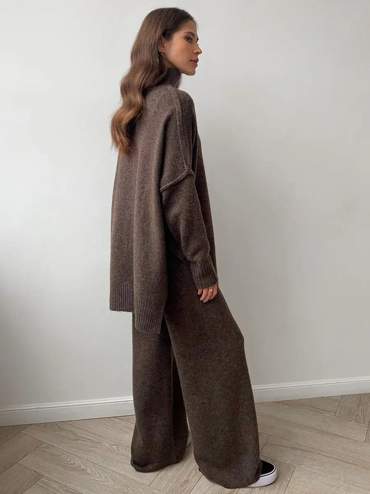 Modern women's comfort wear: chic turtleneck sweater and wide-leg trouser lounge set.