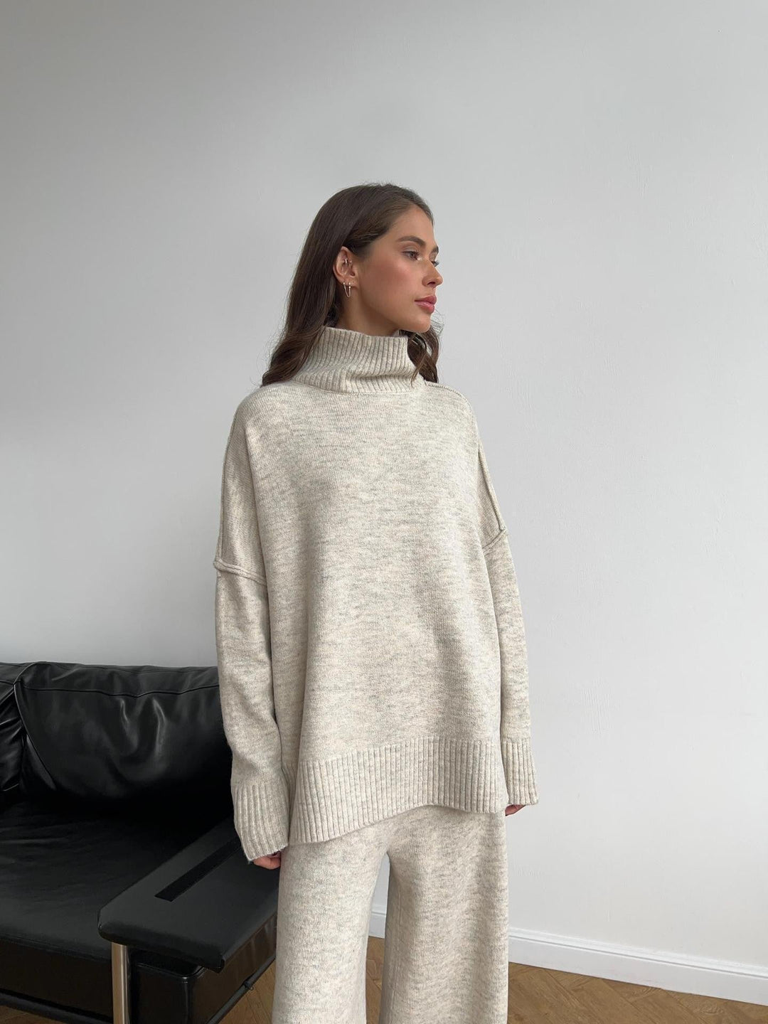 Women's oversized turtleneck and wide-leg trousers lounge set, perfect for relaxed comfort.