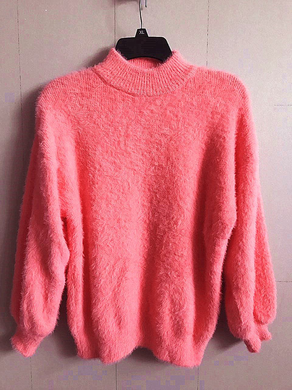 Women's cozy turtleneck sweater, perfect for winter fashion. Relaxed fit, long sleeve, elegant layering piece.