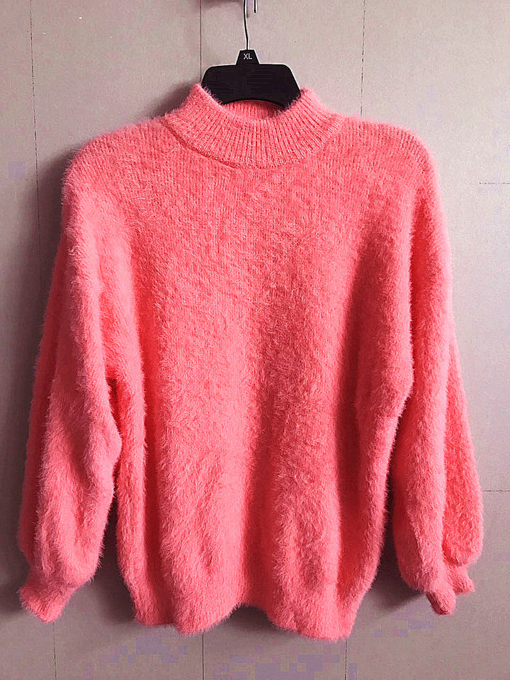 Women's cozy turtleneck sweater, perfect for winter fashion. Relaxed fit, long sleeve, elegant layering piece.