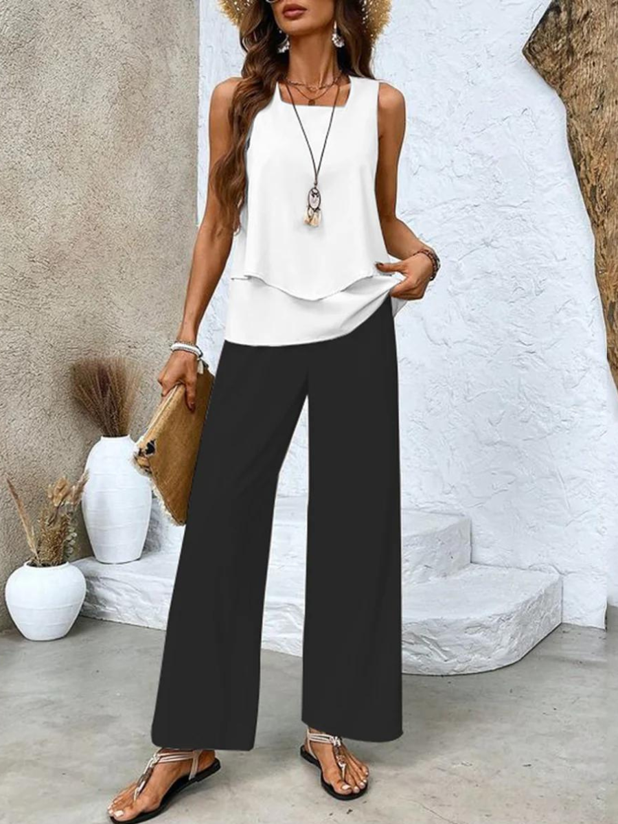 Matching women's outfit featuring a casual sleeveless top and comfortable printed wide-leg trousers, perfect for summer.