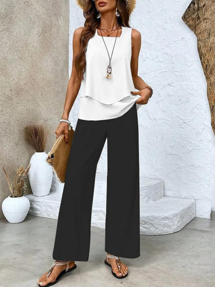 Matching women's outfit featuring a casual sleeveless top and comfortable printed wide-leg trousers, perfect for summer.