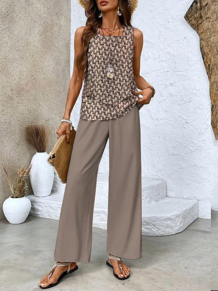 Stylish co-ord set: women's sleeveless top paired with flowy printed wide-leg trousers, a trendy summer outfit.