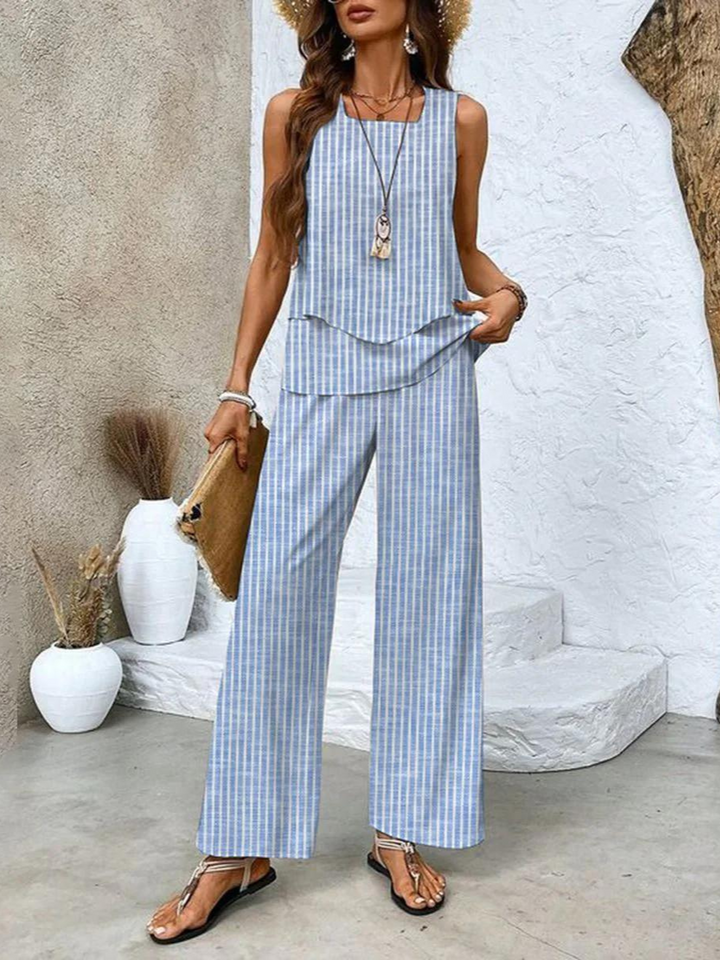 Plus size women's two-piece set: a comfortable sleeveless top and stylish printed wide-leg trousers for any occasion.