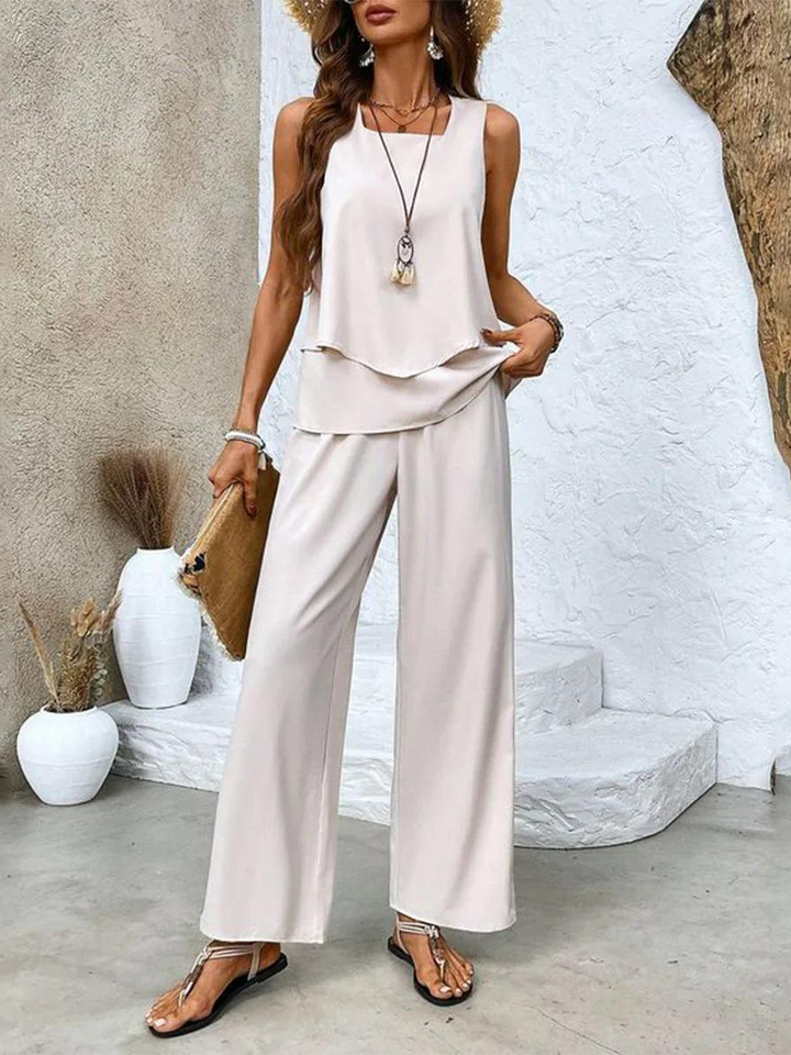 Women's fashionable matching set with a sleeveless top and vibrant printed wide-leg trousers, ideal for summer style.