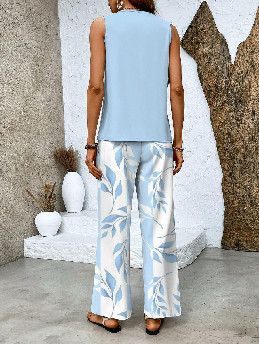 Versatile women's two-piece outfit: a classic sleeveless top combined with modern printed wide-leg trousers for comfort.