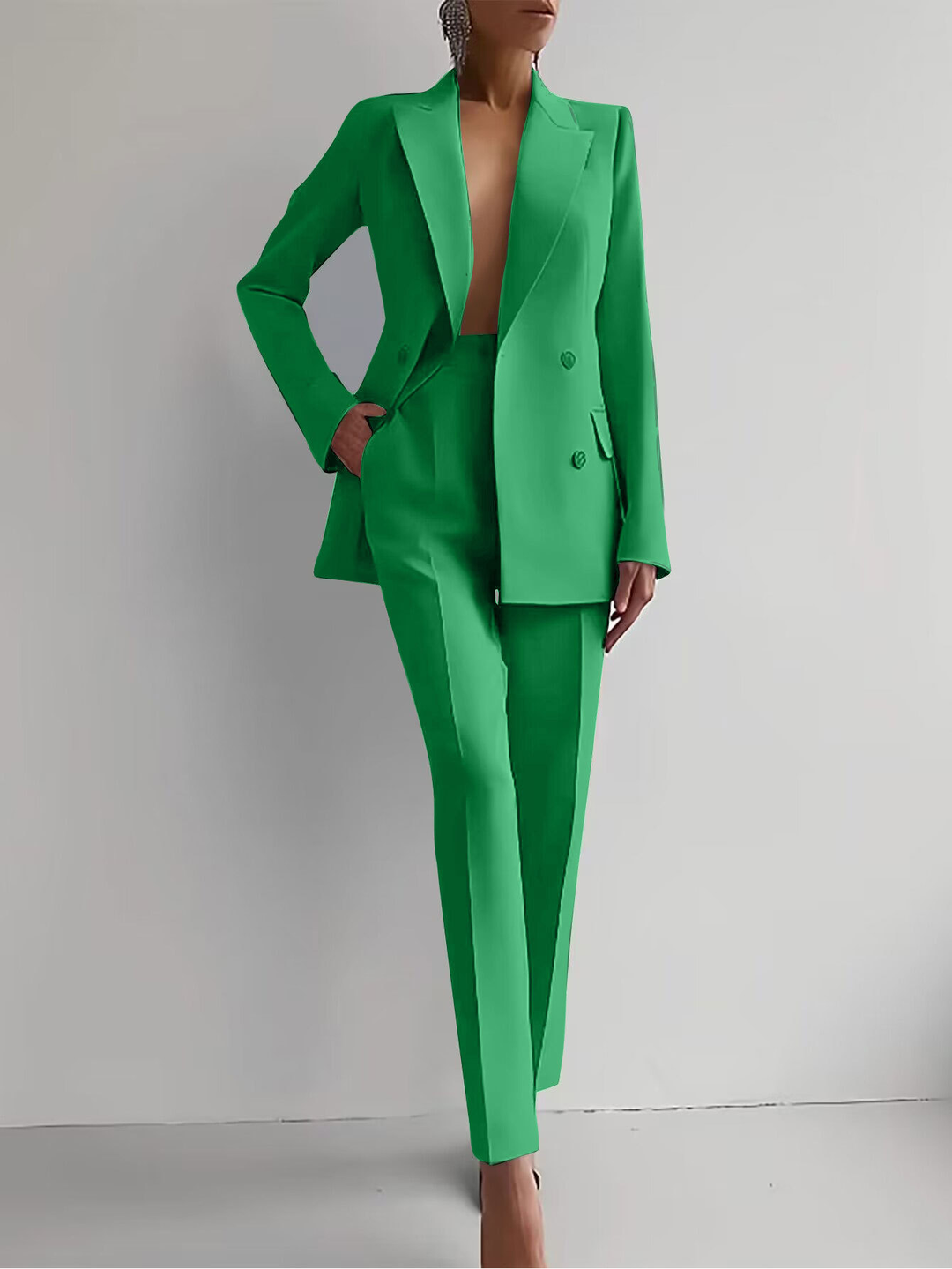Women's fashion two-piece set: a smart suit top paired with trendy tapered trousers.