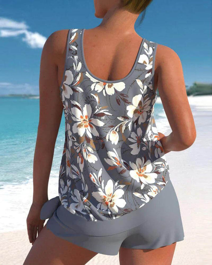 Adjustable women's tankini top with matching comfortable swim bottoms. Stylish two-piece bathing suit.