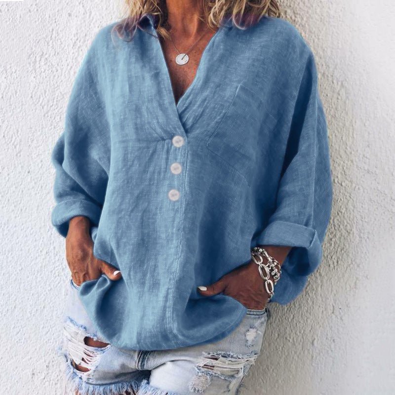 Casual women's V-neck blouse with button-front & roll-tab long sleeves, a chic oversized top.
