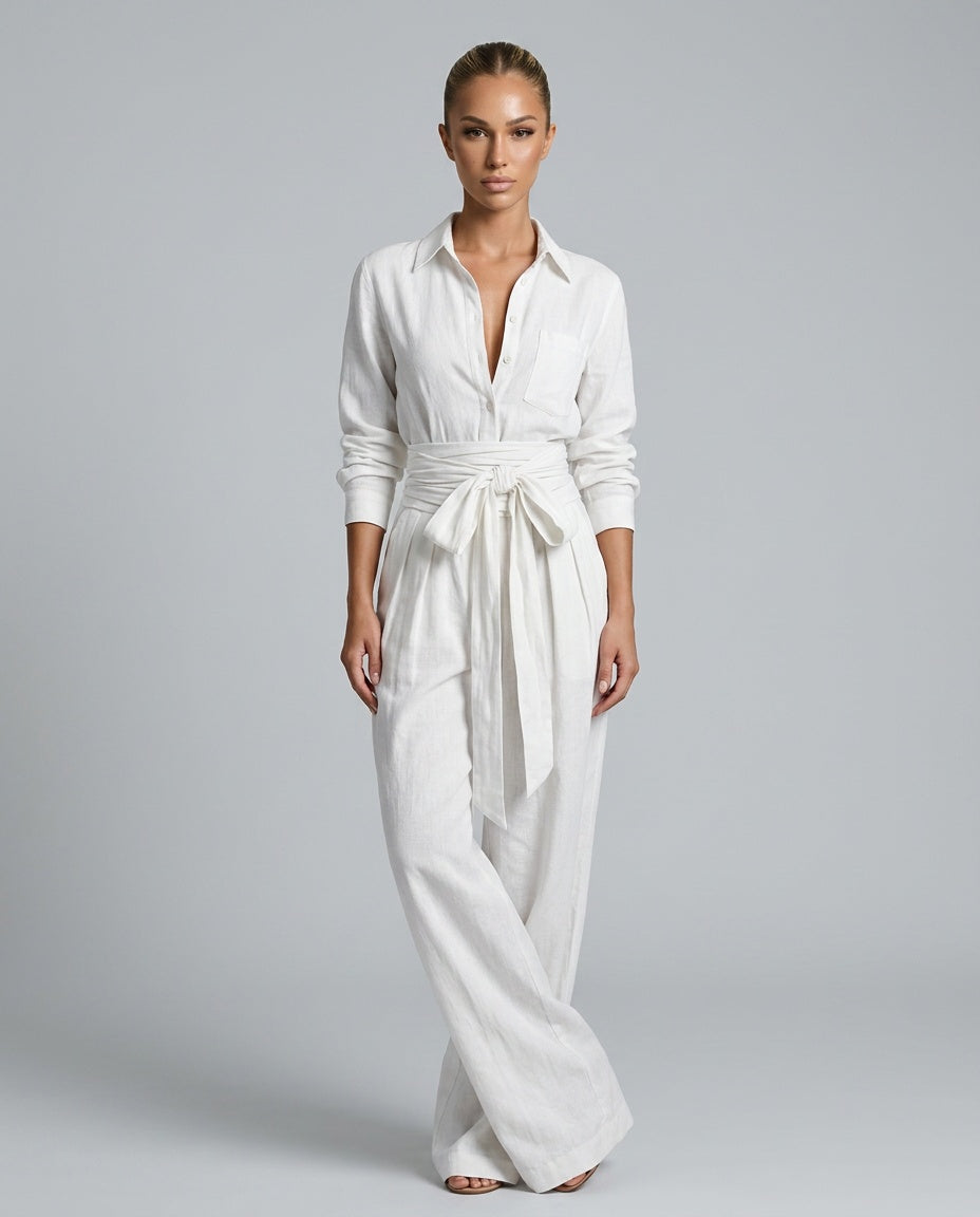 Model wearing a chic women's wide leg jumpsuit with button front, styled for a relaxed elegant look.