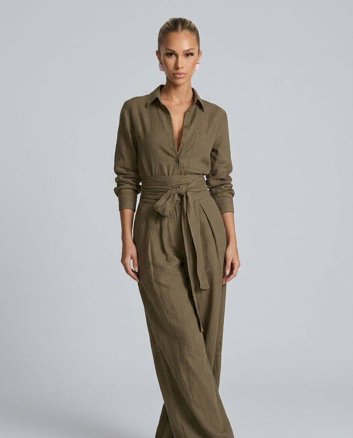 Modern women's wide leg jumpsuit with a sleek button front, offering a relaxed yet refined one-piece look.