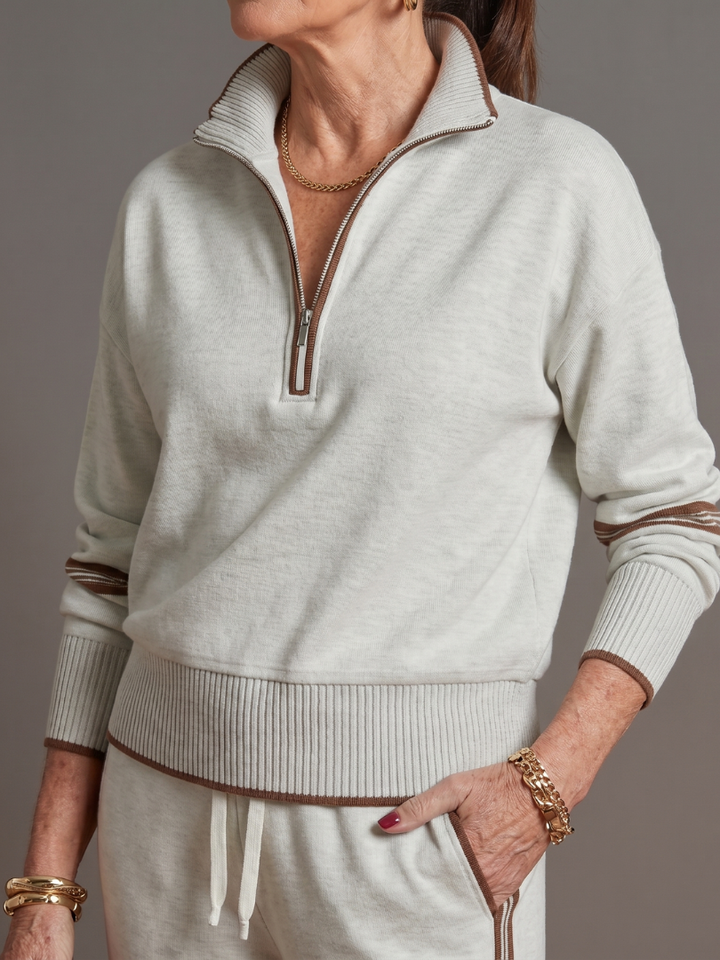 Women's complete chic pants set with zip neck long sleeve top and side stripe wide leg trousers.